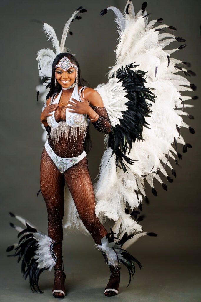 Krewe Carnival 
Mas in Paradise (Bahamas Carnival)
Idyll- white crown pigeon 
noun
1.	an extremely happy, peaceful, picturesque period  or situation, typically an idealized or unsustainable one.